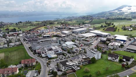 industrial area of samstagern town with construction site on working cranes on hill