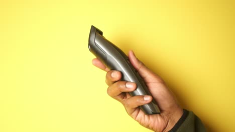 person holding a hair clipper
