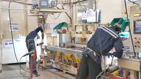 asian worker wear protection working in heavy metal factory, editorial