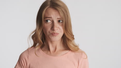 caucasian woman chewing on camera.