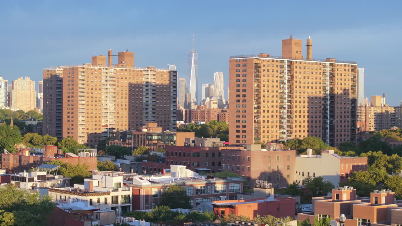 Aerial view of the World Trade Center between two apartment buildings in Brooklyn. Shot on a summer morning in New York City.