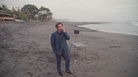 handsome businessman having phone call
