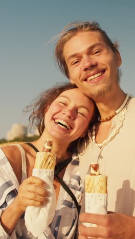 happy couple enjoying shawarma