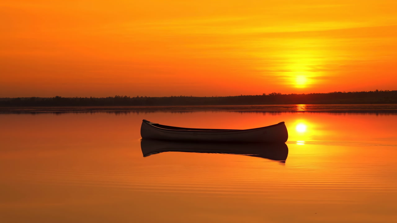 Solitary Canoe On Glassy Lake Sunrise Golden Hour Warmth, Calm Orange Sky, Perfect Mirror Reflection, Minimal