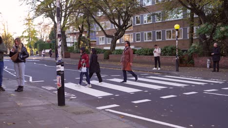 people crossing the abbey road zebra crossing in london