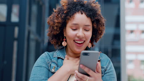 winning, phone and black woman in city fist pump