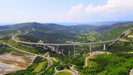 stunning 4k drone footage of the iconic črni kal bridge in slovenia, a masterpiece of architecture amid breathtaking natural surroundings