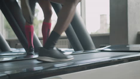 Close-up view of man&#039;s feet running.
