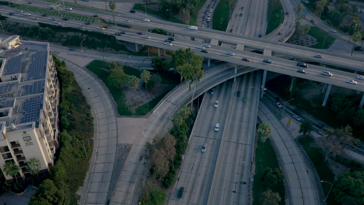 Aerial View of a Bustling Highway Interchange and City Skyline