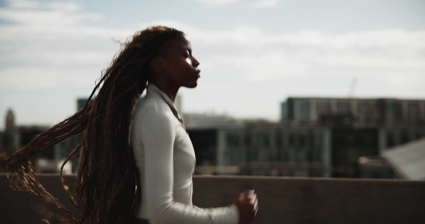 Young Woman Jogging Outdoors in Urban Setting
