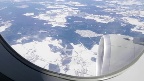 airplane over the russia in winter.