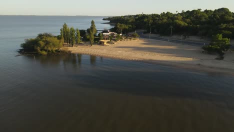 aerial view of sandy beach and river plate during sunrise at border between uruguay and argentina