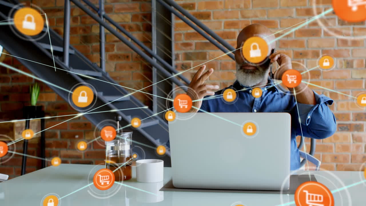 animación de una red de conexión sobre un hombre de negocios afroamericano usando un teléfono inteligente y una computadora portátil