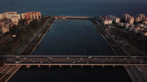 Car-crossing-between-lake-and-sea