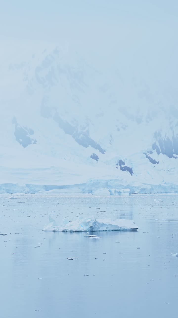Sea Ice and Mountains in Antarctica Winter Scenery with Dramatic Mountain and Glacier, Beautiful Antarctic Nature and Landscape, Vertical Video for Social Media, Instagram Reels and Tiktok