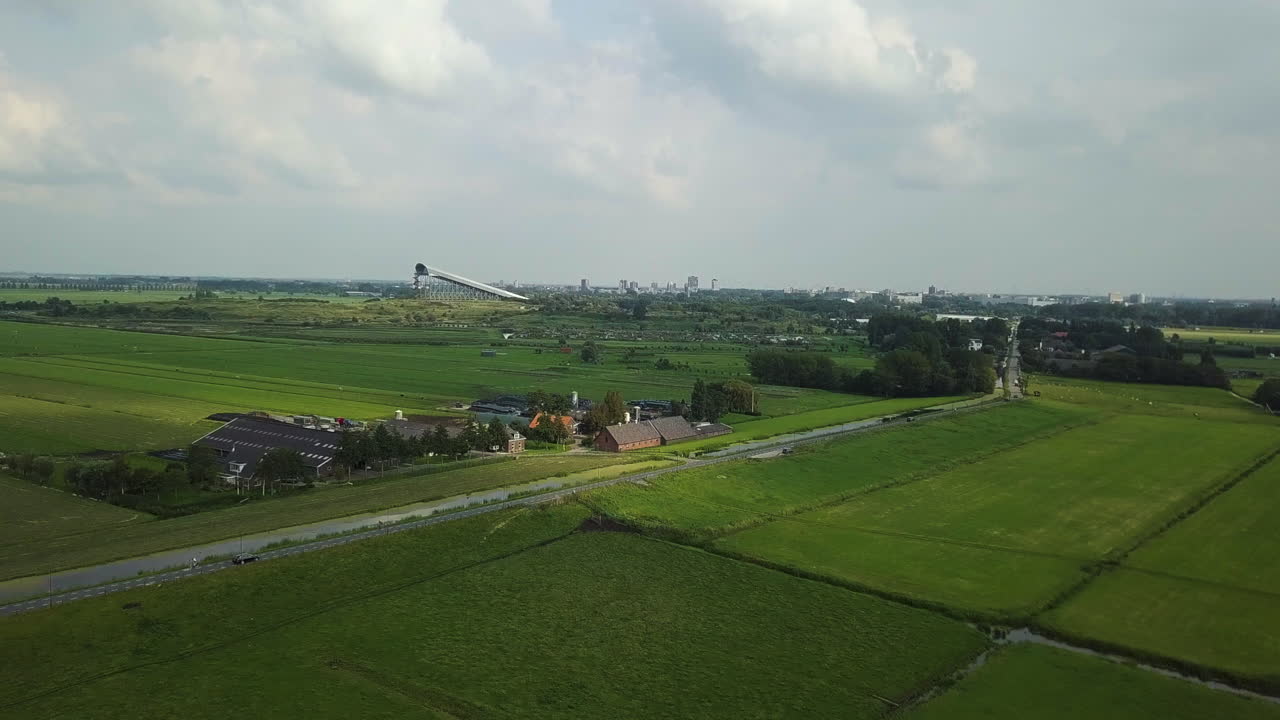 Aerial view over green fields from Wilsveen in the Netherlands, flying towards SnowWorld Zoetermeer