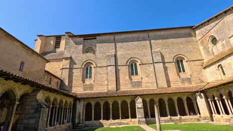 historic courtyard with stone architecture and greenery