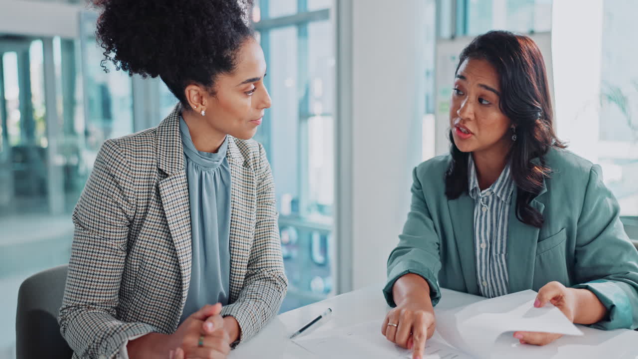 Two businesswomen collaborating in an office