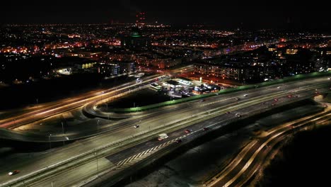 top down night city roads with cars driving aerial view