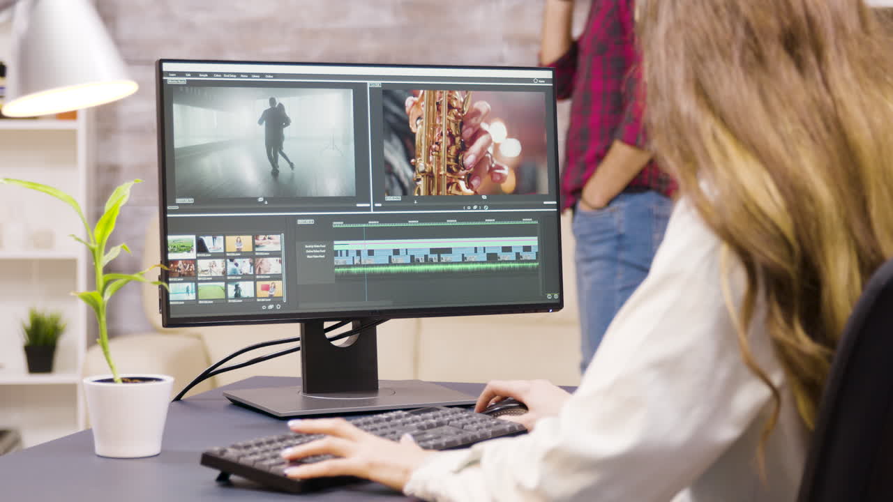 Woman editing a music video on her computer