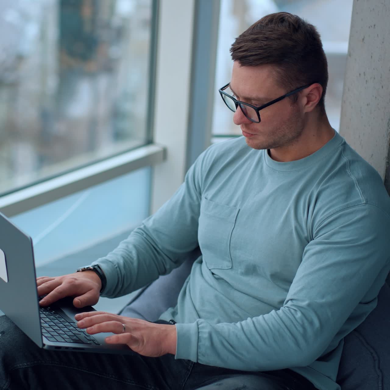 Young entrepreneur working with laptop. Professional businessman typing on computer