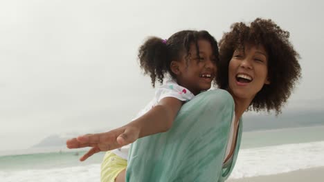 family enjoying free time by the sea