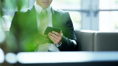 male caucasian financial advisor working with wireless tablet