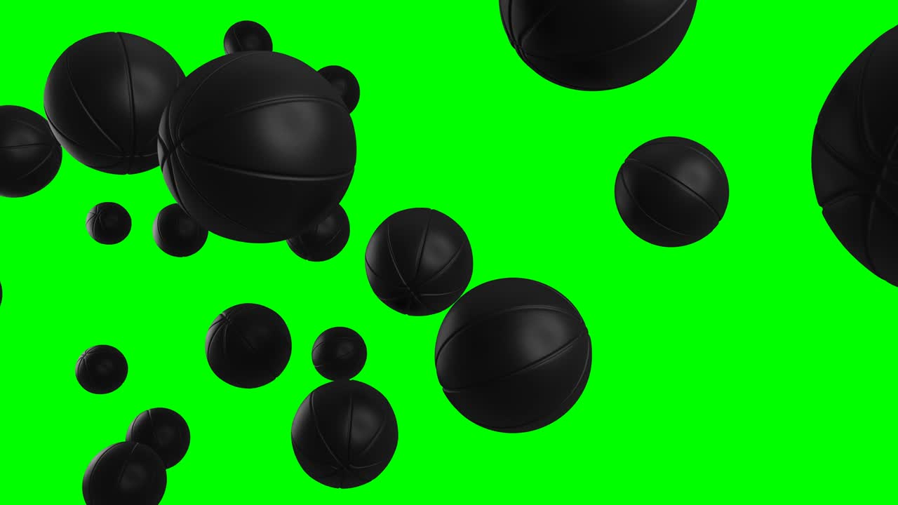 muchas bolas de baloncesto negras en llave de croma verde.