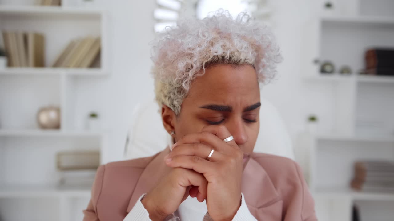 Discompose african american woman office worker experiences stress at work