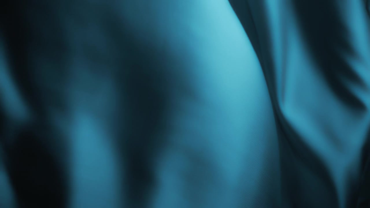 Wavy blue chiffon fabric flowing in the wind. Abstract texture background