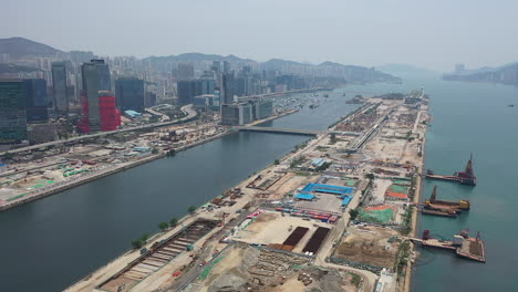 aerial view of hong kong, kowloon bay, cruise terminal and public pier on sunny day, drone shot