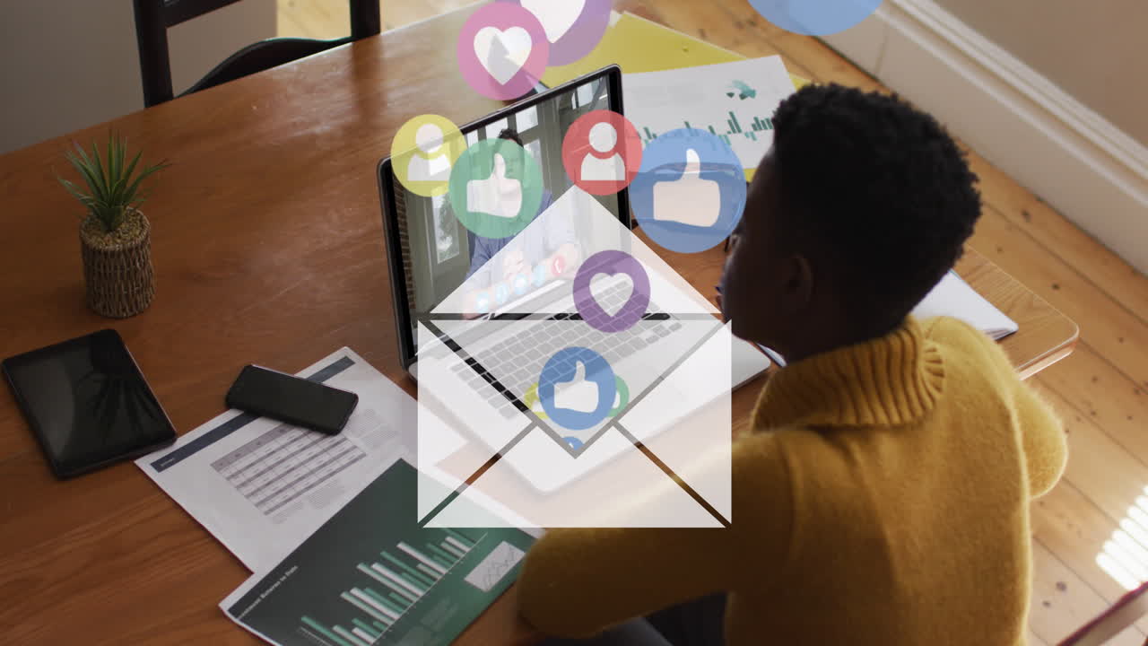 Animation of social media icons data processing over african american woman on laptop video call