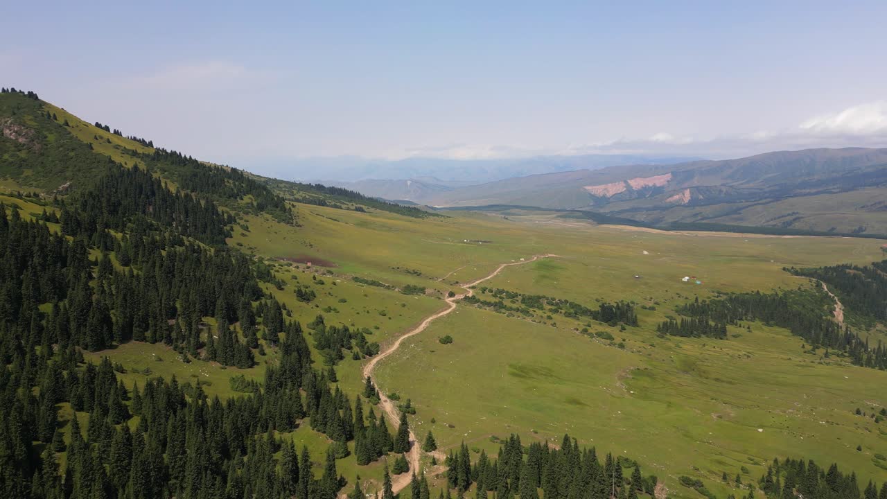 Scenic Mountain Landscape with Green Hills and Forest