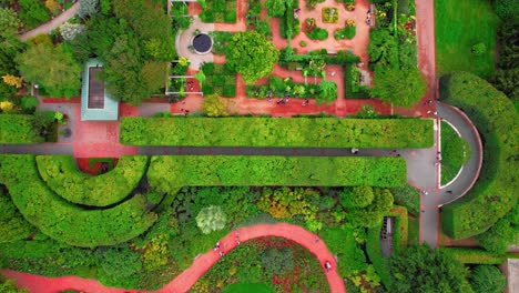 Bird-eye-aerial-over-colorful-Chicago-Botanic-Garden,-horticultural-oasis-nestled-in-the-heart-of-Glencoe,-Illinois,-just-a-short-drive-from-the-bustling-city-of-Chicago