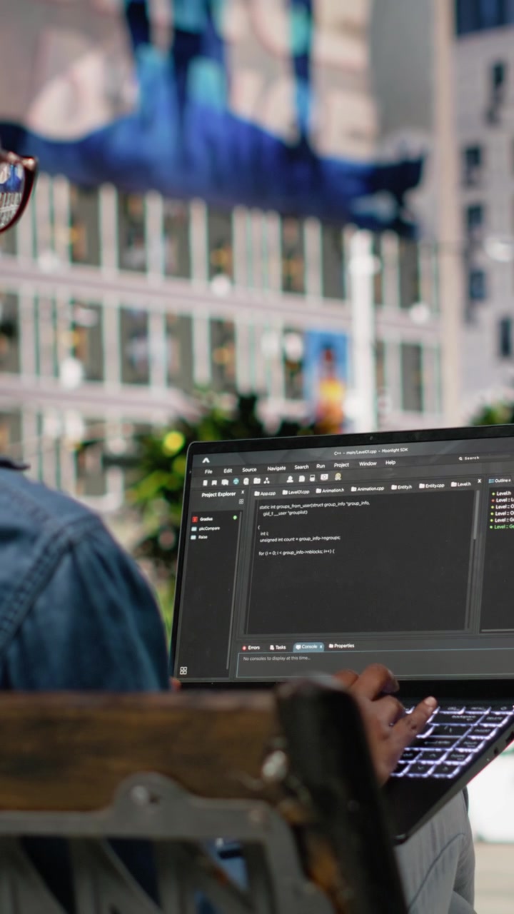 Vertical Video Writing code on laptop, implementing programming language, software developer