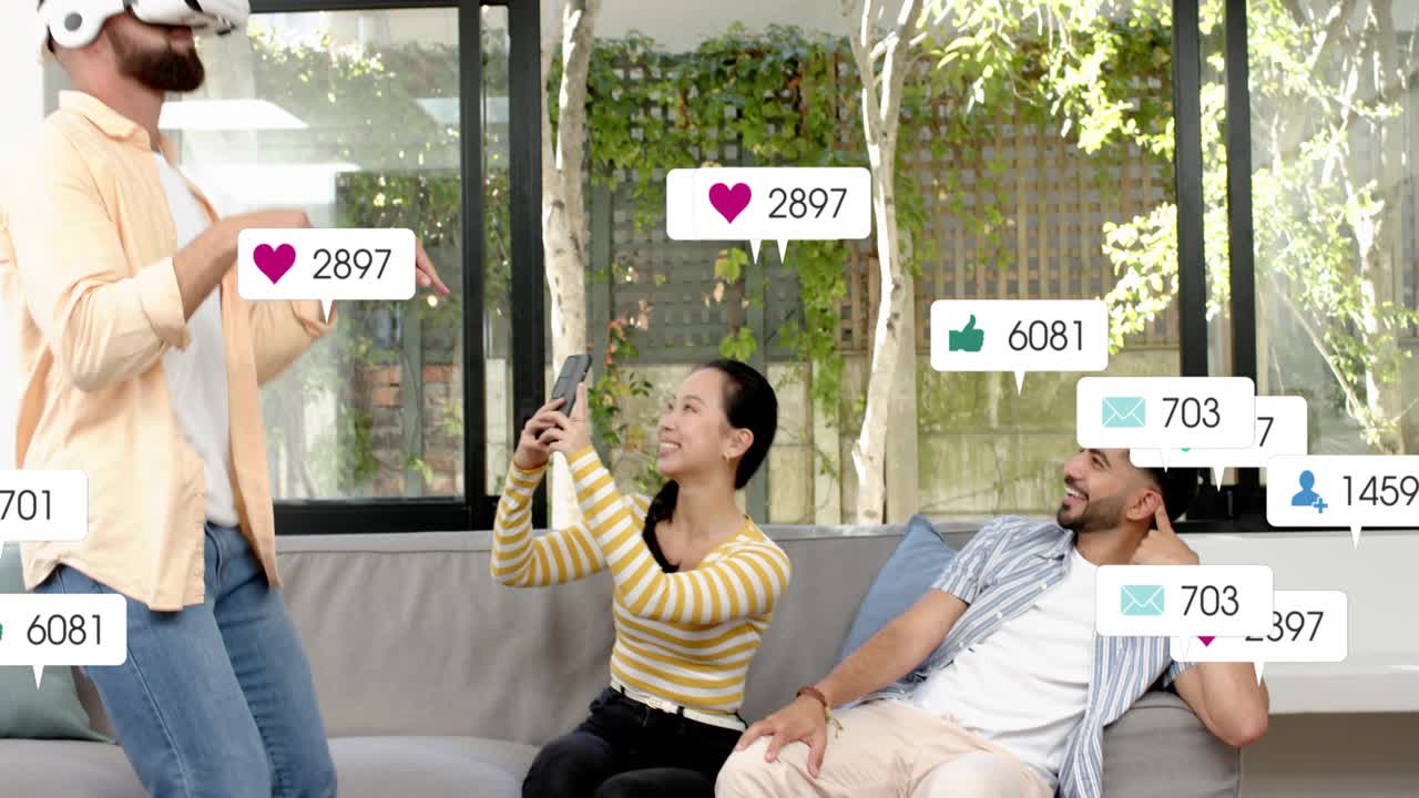 Bearded man in VR headset rising, gesturing on sofa, multiplying social badges around him for likes