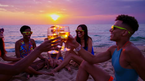 friends celebrating sunset on the beach