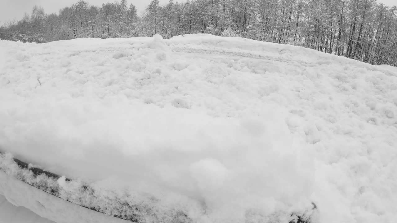 POV man shovelling snow out of driveway after winter blizzard