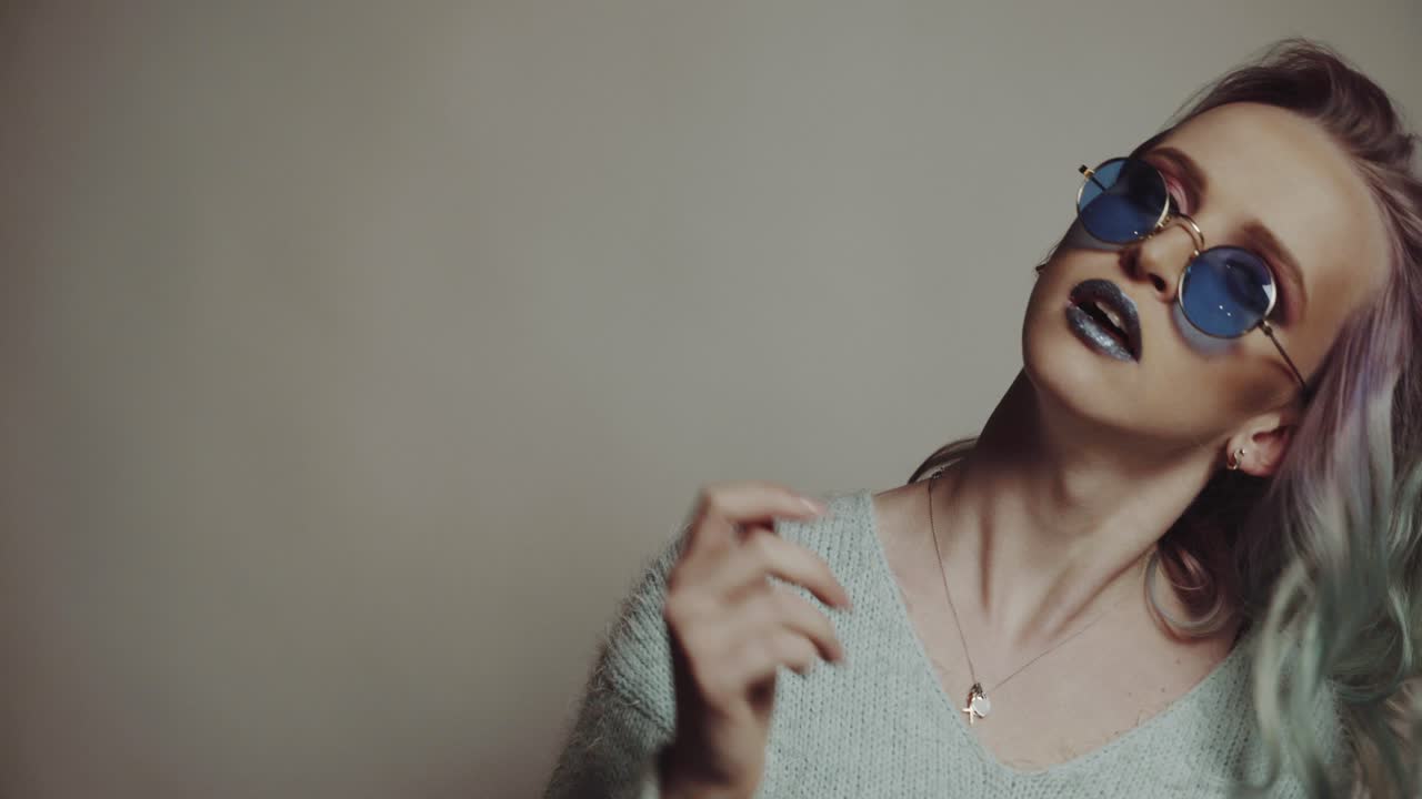 Beautiful girl with colored hair. Colored hairs. Portrait of smiling woman with color hairs. Gradient