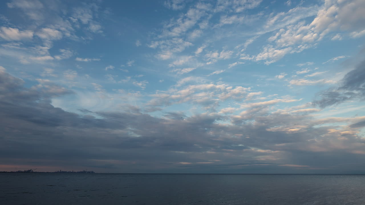 Lake Ontario, expansive water and sky with soft, calming clouds