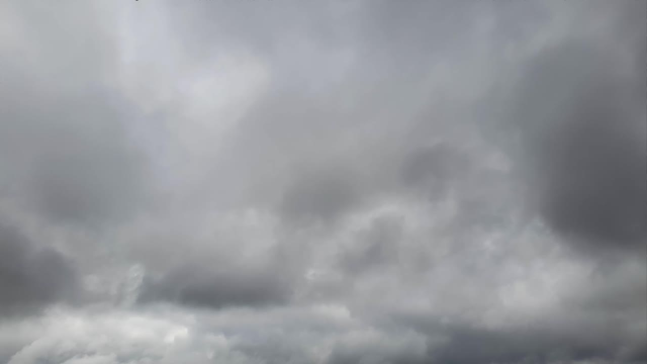 Mid afternoon thunderstorm rain clouds forming and blending across the african horizon time lapse, noise free 4k footage