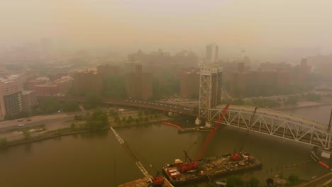 Aerial-view-of-red-bushfire-smog,-polluting-the-air-in-Harlem,-New-York,-USA