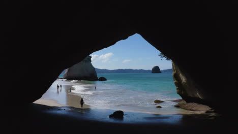 cathedral cove, a stunning rock arch on the beach in new zealand