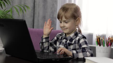 Girl-doing-online-homework-using-digital-laptop-computer.-Distance-education