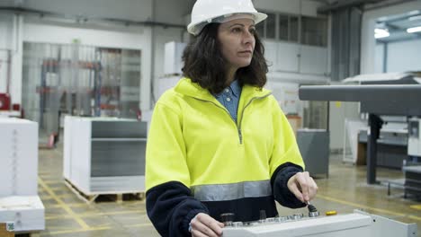 concentrated female worker setting printing machine