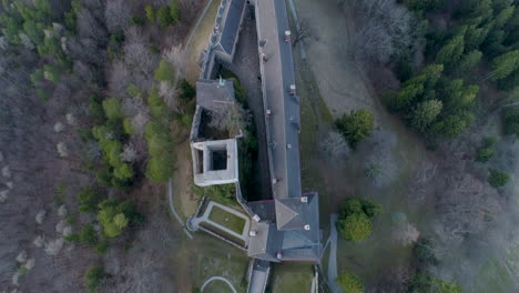 straight down drone shot of a castle on a hill, 4k uhd