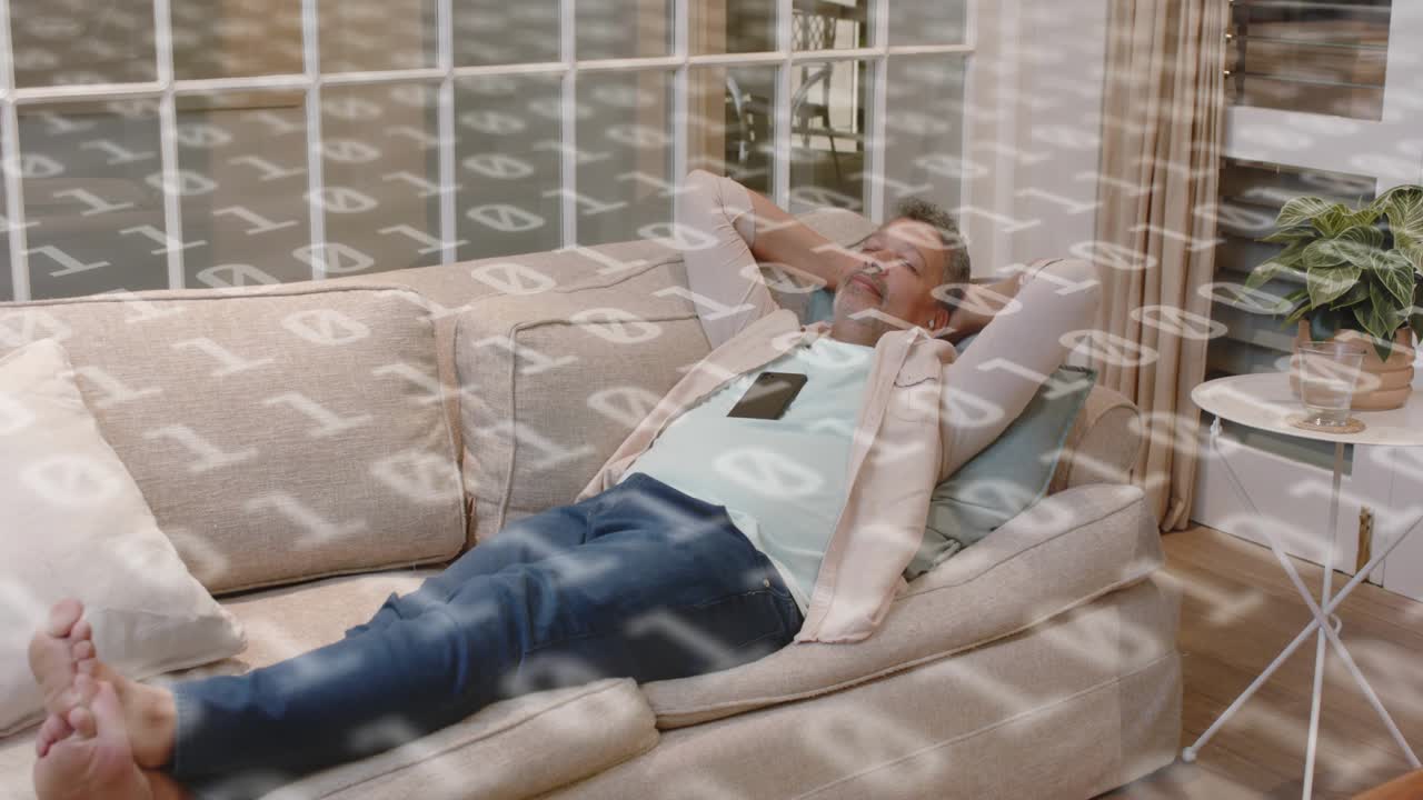 Man reclining on sofa shifting for comfort, phone resting on chest, binary overlaying subject tech