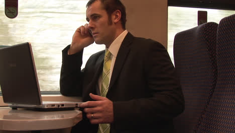 businessman working on a train