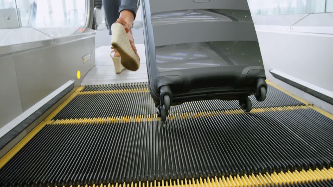 Businesswoman with suitcase standing on elevator 4k