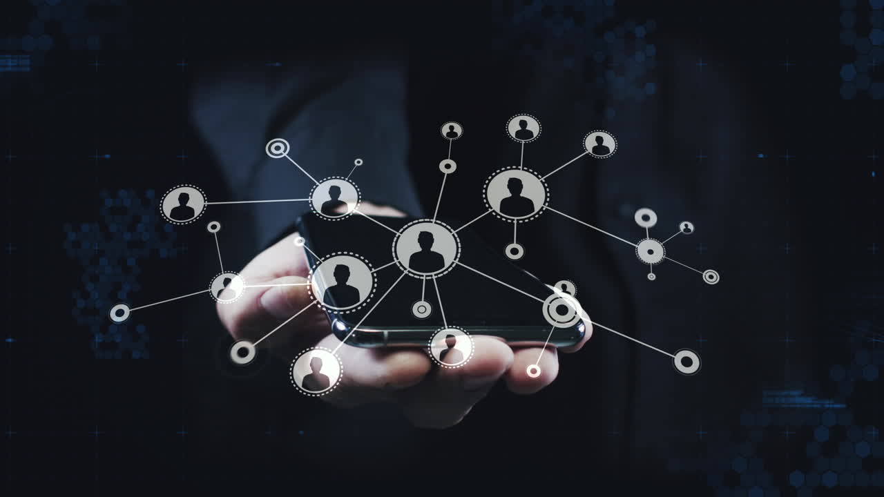 Animation of network of connections with icons over smartphone screen held by businessman